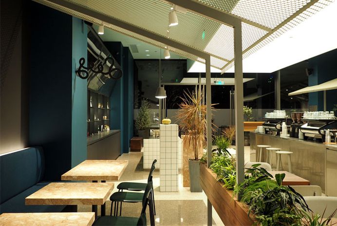 Shining Metal Bar at Seesaw Coffee by NOTA Architects - InteriorZine