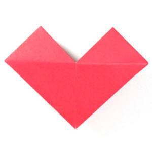 How to make a small origami heart (http://www.origami-make.org/howto-origami-heart.php)
