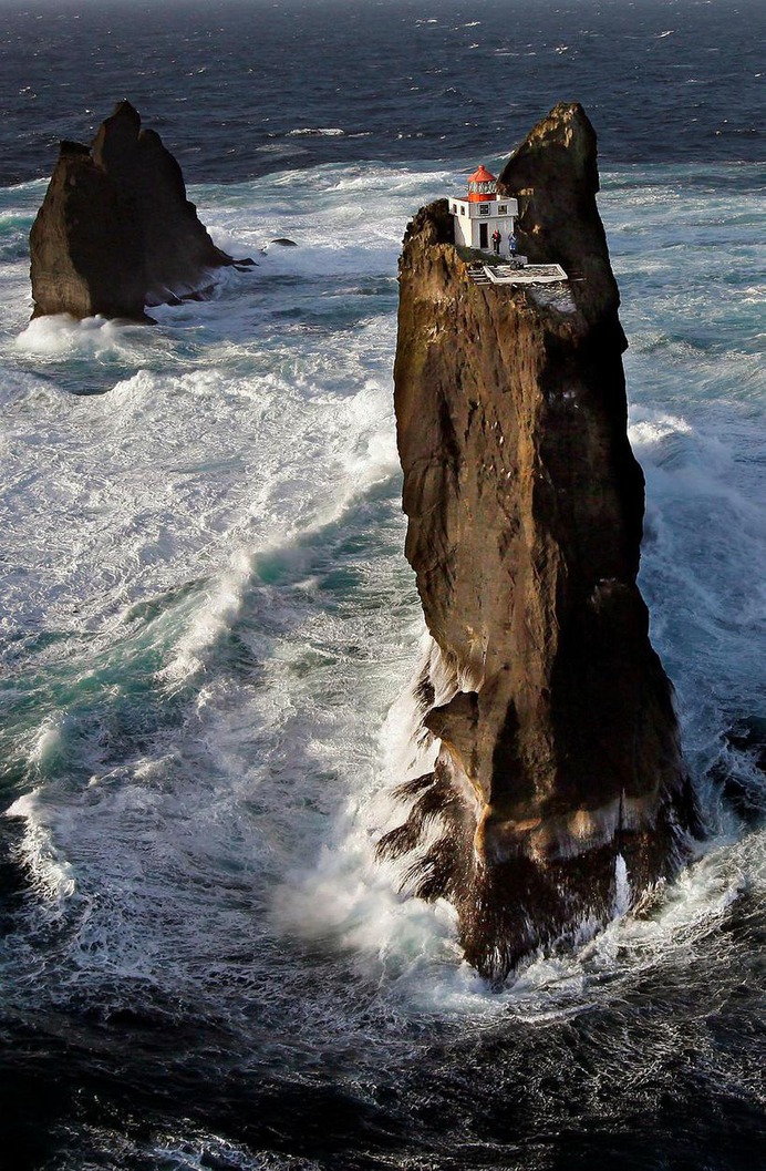 Incredible location for a lighthouse perched on a rock in Iceland's wild surf - Iceland Monitor