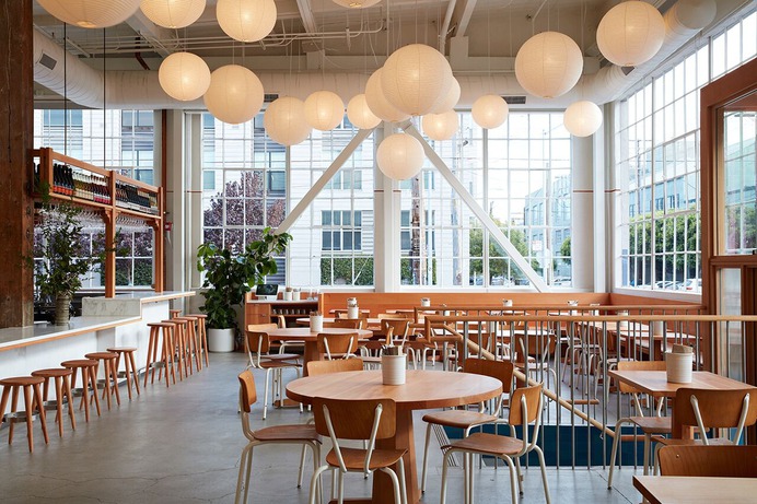 A galaxy of trend-resistent Noguchi lanterns illuminates the dining area of Manufactory. Photograph by Mariko Reed, from 7 Ideas to Steal from the Manufactory in SF by Commune Design.