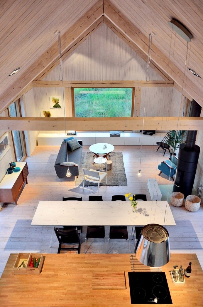 Oblong House is Designed to Sit Naturally in the Open Field Landscape 5