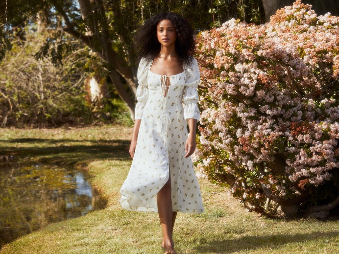 This is a backless dress with a mock neckline and long sleeves.