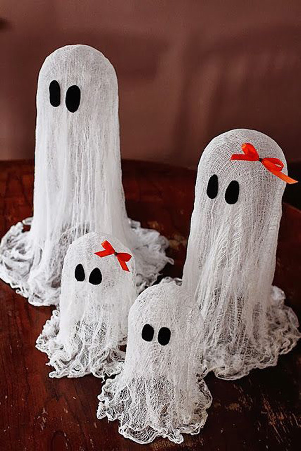 Tiny ghost figures. This miniature ghost family figure in cheesecloth looks spooky and at the same time adorable. A perfect centerpiece for