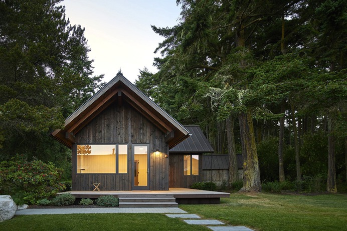 Exterior, Gable RoofLine, Wood Siding Material, Metal Roof Material, and Cabin Building Type Sleeping Cabin at sunset. Photo 7 of 19 in Island Cabins by goCstudio