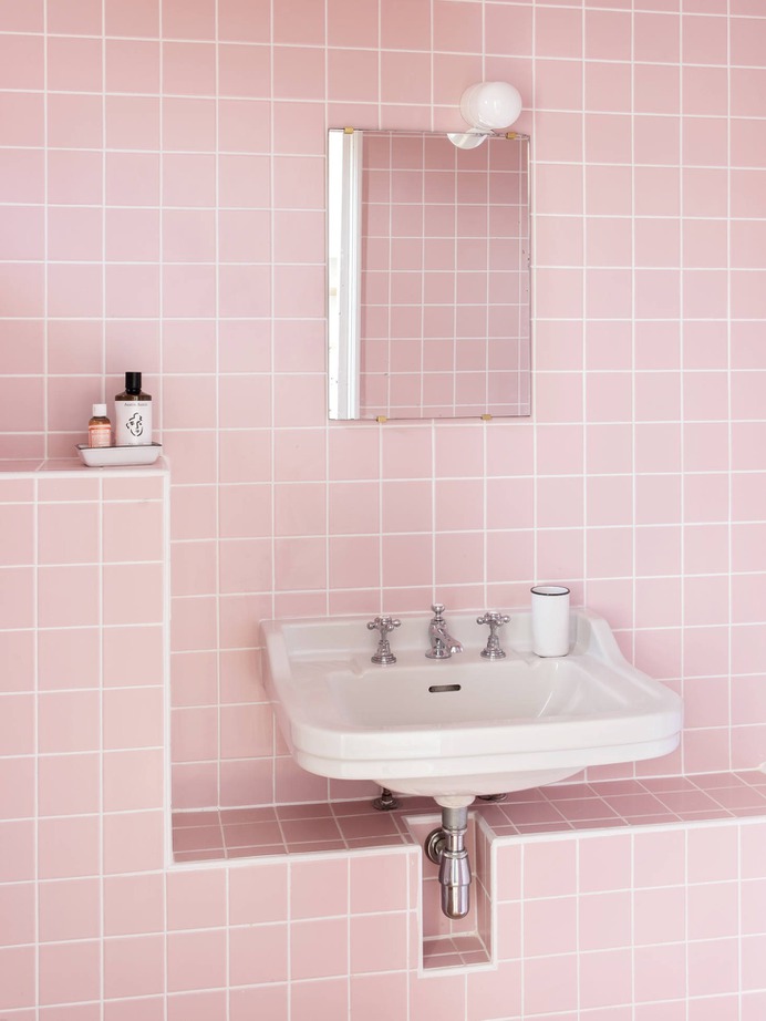 Feilders installed seven new bathrooms in the house and annex, no two exactly alike. This one has one of the house's original sinks set in a tiled niche. (Pink tiles sourced from Palatino.)
