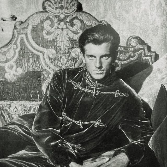 Hubert de Givenchy rocking a fabulous velvet smoking jacket, sometime around 1940. 