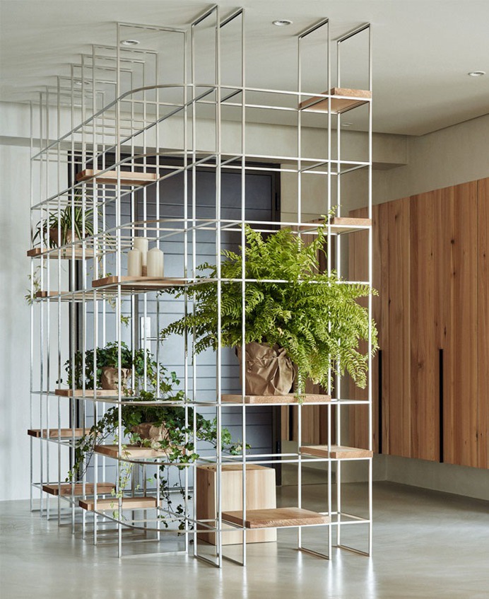 Loft Living Space Blending Organic Design and Industrial Style Accents - InteriorZine