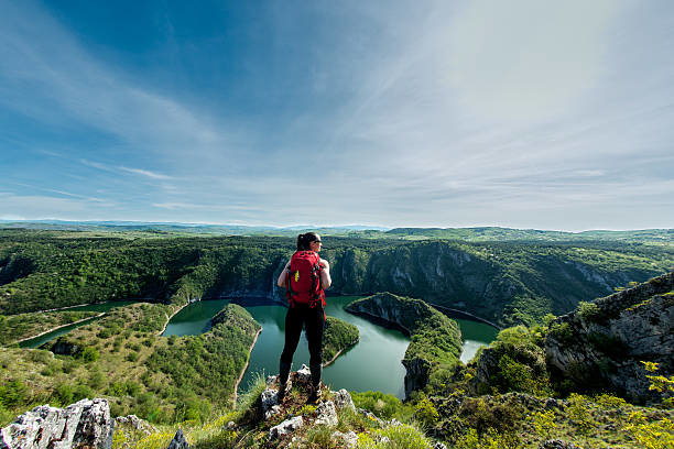 Hiking woman on top of a hill