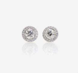 A PAIR OF STUD PIN PLUG DECORATED WITH BRILLIANT-CUT DIAMONDS