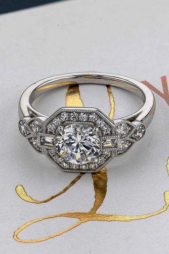 Vintage engagement ring has elegant and romantic shape with sophisticated enchanting details that will be stunning on her finger.