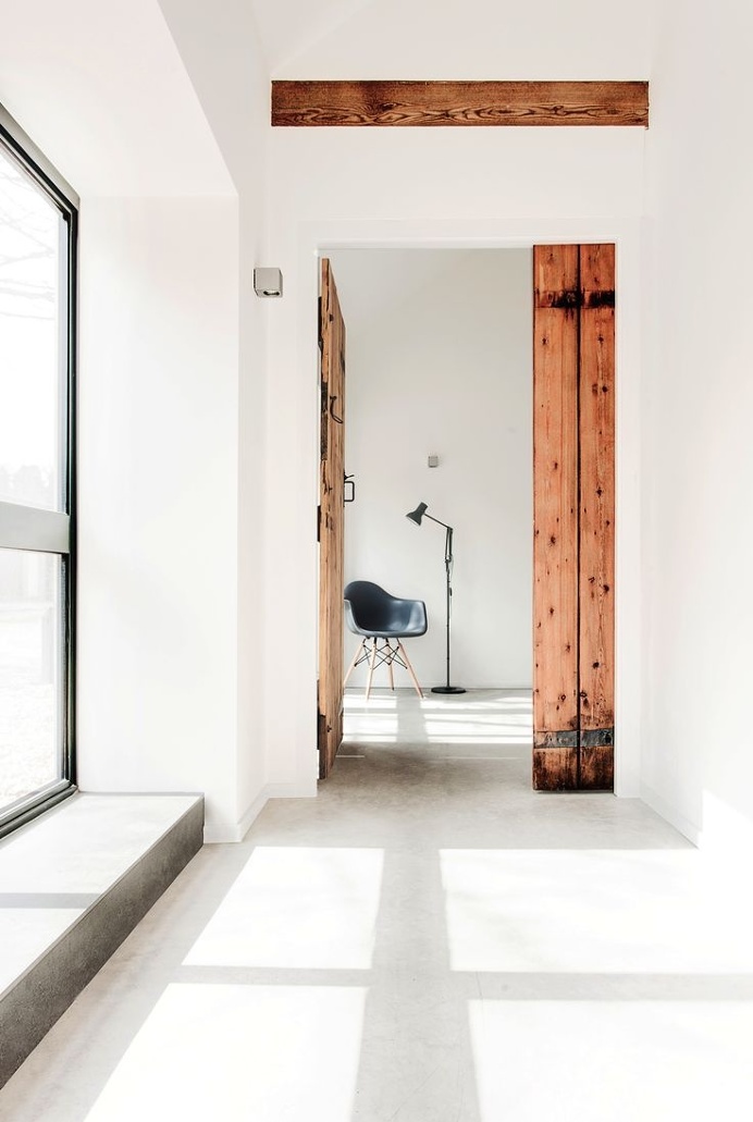 #Hallway in a #house converted from #stables. #TheStables by #ARDesignStudio. Photo by #MartinGardner. #concretefloor #contemporary