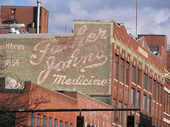Father John's ghost sign by wemcg via Flickr