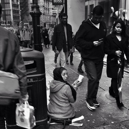 Roma woman begs near @harrods as weekend shoppers walk idly by #Knightsbridge #London #BOSS #PRET