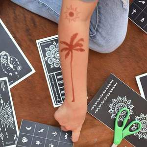 Palma - henna temporary tattoo of palm tree on forearm Modern henna tattoo designs now include a large, minimalist palm tree via Mihenna's adhesive stencils. Our henna stencils help you achieve a flawless look.