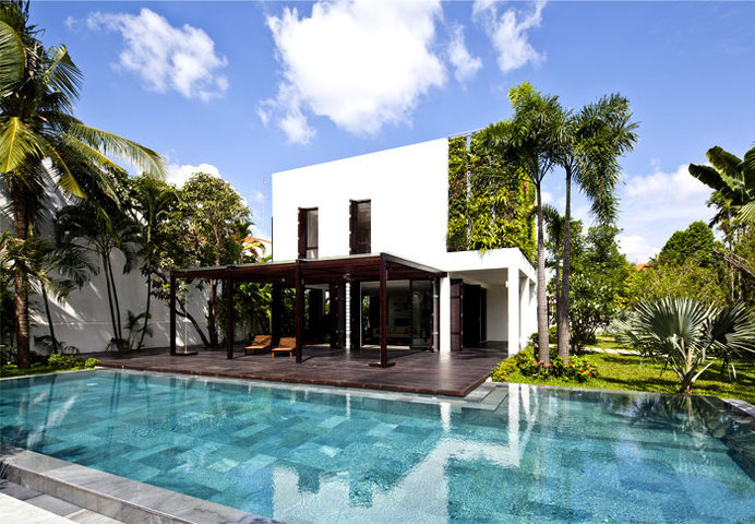 Green Villa with Clean Lines and Open Spaces rich plant life pool area #house #pool #wall #architecture #green