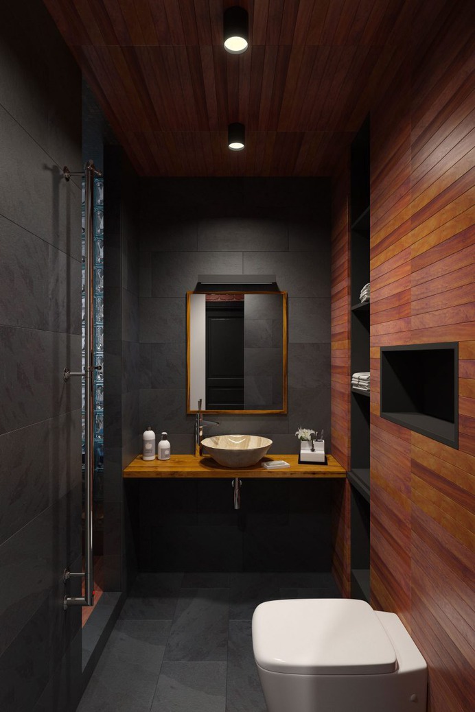 Dark tile with dark wood bathroom finishes