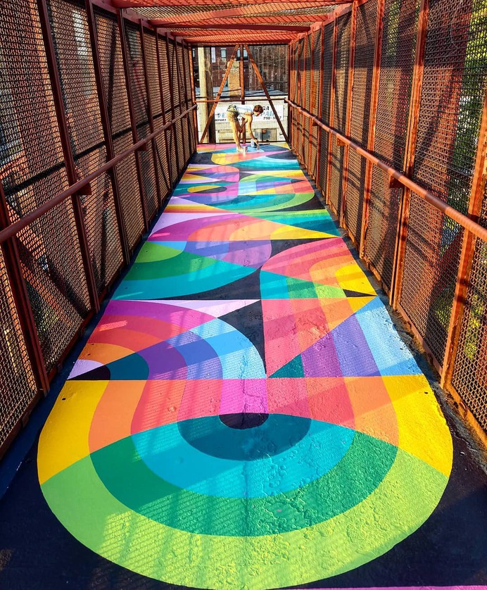 Artist Duo Brings Life Into A Boring Old Stairway By Painting A Bright And Colorful Rug-Shaped Mural