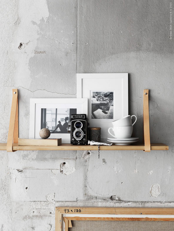 Wooden+leather homemade shelf on concrete wall
