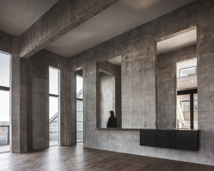 Concrete interiors at "The Silo" by COBE in Copenhagen A former silo in Copenhagen transformed into a stunning residential complex | Ne