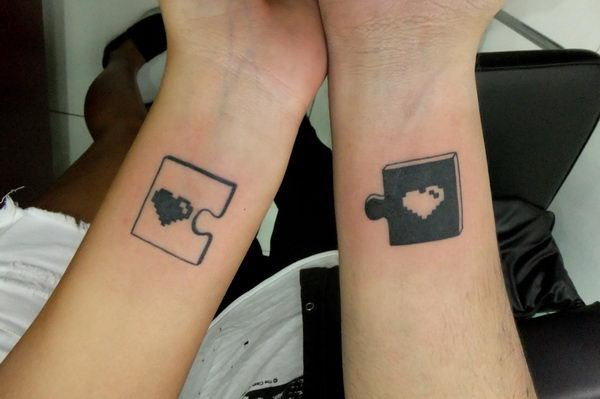 couple tattoos puzzle pieces