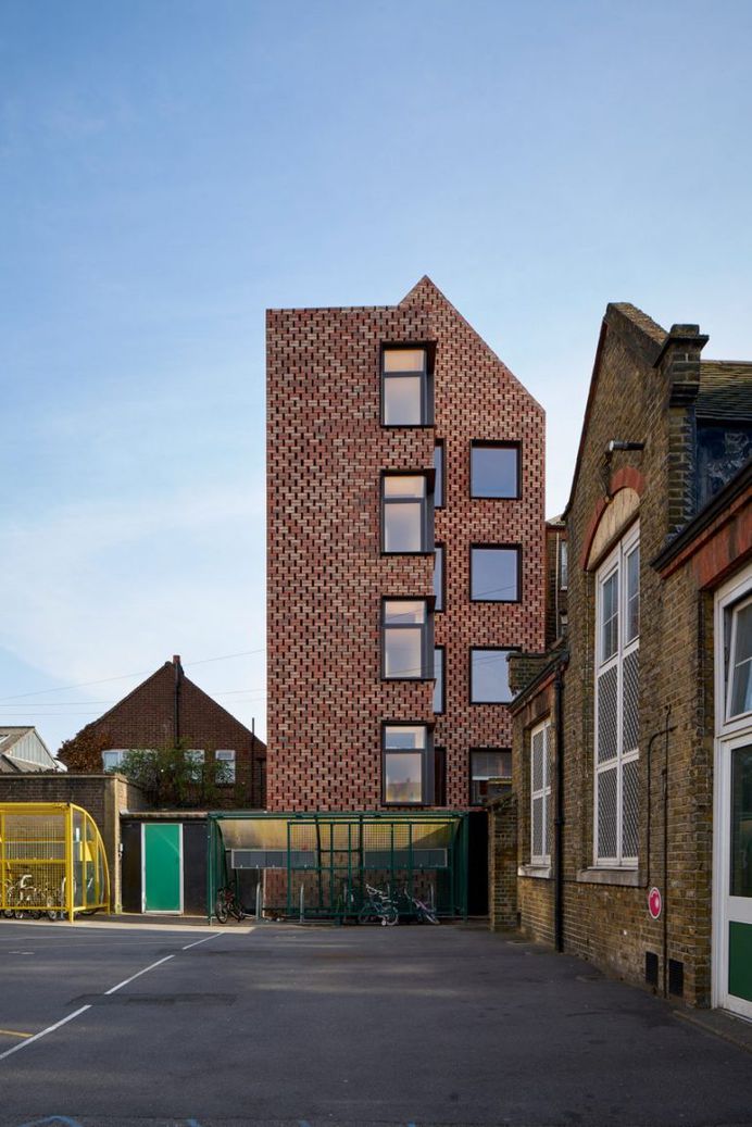 Slender apartment block by Amin Taha Architects has timber structure