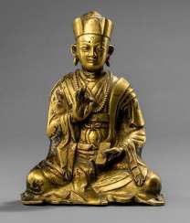 Fire gilt Bronze of a seated priest
