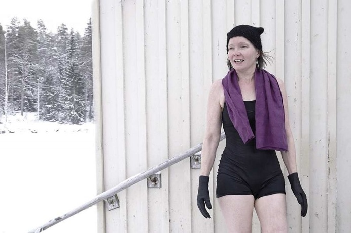 Winter Swimming in The Frozen Lake by Markku Lahdesmaki