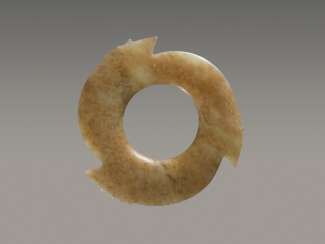 A FASCINATING YABI, OR NOTCHED DISC, WITH THREE POINTED PROTRUSIONS ENRICHED WITH THIN AND DELICATELY CARVED NOTCHES