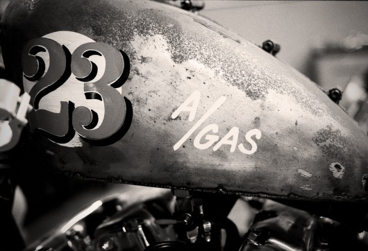 agas1copy.jpg (image) #sign #painted #gas #numbers #type #hand #motorcycle #typography