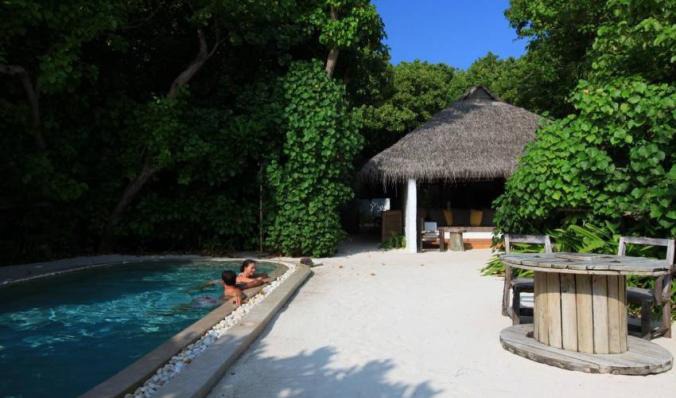 This charming 5-Star Family Villa in Maldives, has a prime beachfront location and is surrounded by swaying palm trees and fresh, calm ocean breeze, private pool and modern amenities. Book with Villa Getaways.