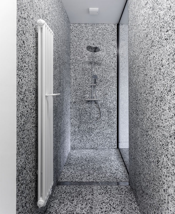 Trendy Terrazzo and Herringbone Parquet at Renovated Apartment by Alexandru Szűz Pop - InteriorZine