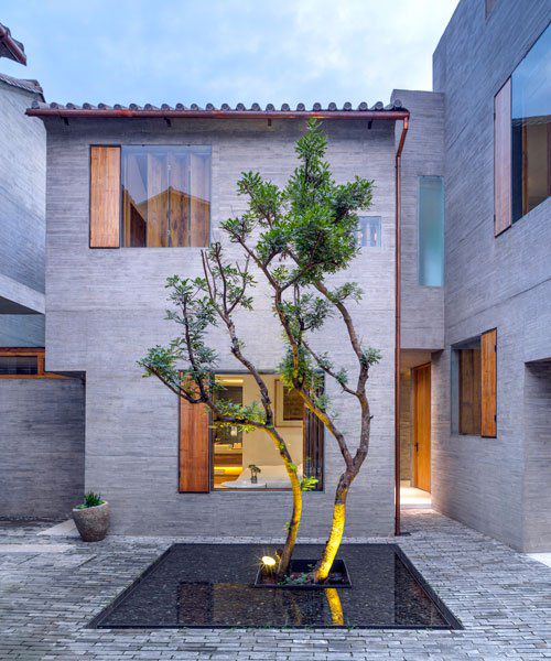 zhaoyang architects designed this boutique hotel as a hidden urban oasis in china