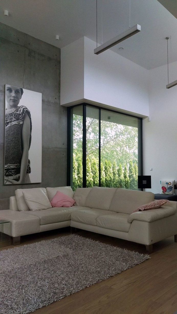 L-Shaped Family Home Exhibiting A Distinctive Roof And Custom Interior 5