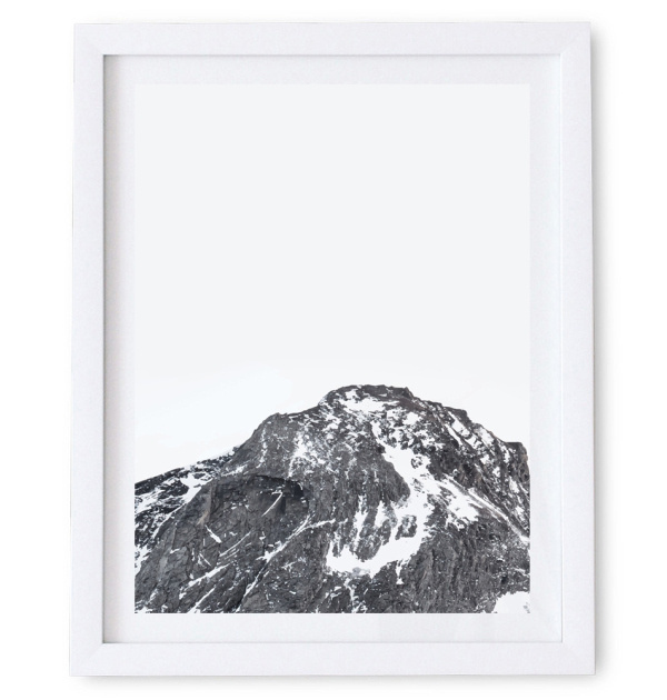 Artwork featuring beautiful snow caps which seem to scatter and fall on a dark black mountain.