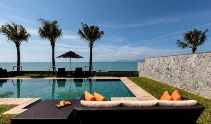 Absolute Beachfront Luxury 8 Bedroom Villa. Double wood doors, an charming lotus pond and graceful Thai-inspired artwork greet you on arrival. Book with Villa Getaways.