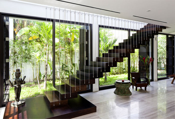 Green Villa with Clean Lines and Open Spaces beautiful free hanging wooden staircase #stairs #interior #saircase #design