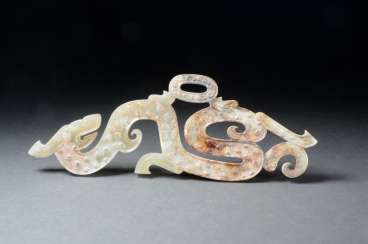 SPIRAL HORNED DRAGON WITH A YOUNG COUNTERPART TO THE FAMOUS DRAGON AMULET AT THE MUSÉE GUIMET