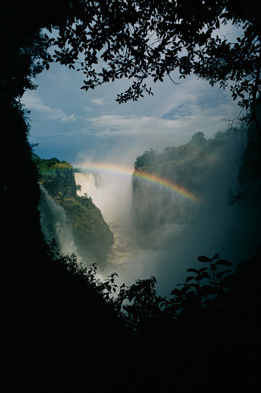 A rainbow arches over Victoria Falls in Zimbabwe. Photograph by Volkmar Wentzel, National Geographic Creative