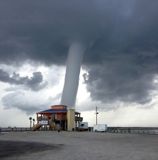 This photo provided by 'Buggie' Vegas, owner of Bridge Side Cabins and Marina in Grand Isle, La., shows a waterspout on Grand Isle, La. T #tornado #spout #water #whirlwind #photography #storm #nature