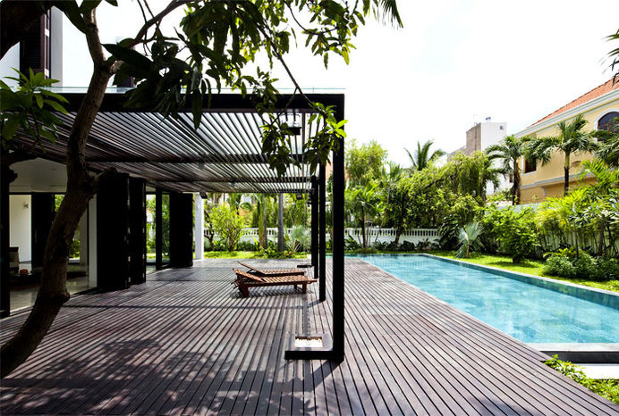 Green Villa with Clean Lines and Open Spaces wooden decking #outdoor #pool