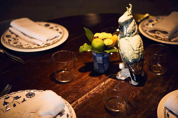 Animal-themed ceramics anchor each table.