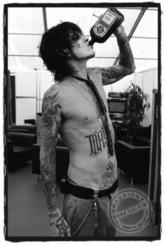 Tommy Lee of Motley Crue hitting the bottle by Ross Halfin #tommy #lee #motley #crue