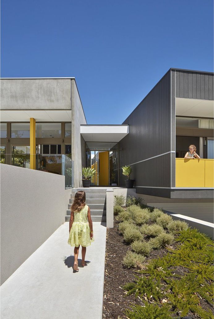 Coastal Suburban Home Featuring Bright, Vividly Colored Spaces 1