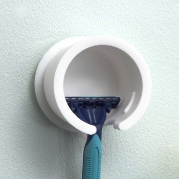 Keeping razor blades sharp is easier with the Mog Wall Shaver Holder, which lets water drain at the bottom to keep the razor blades dry and #design #home #bathroom #product #industrial #holder