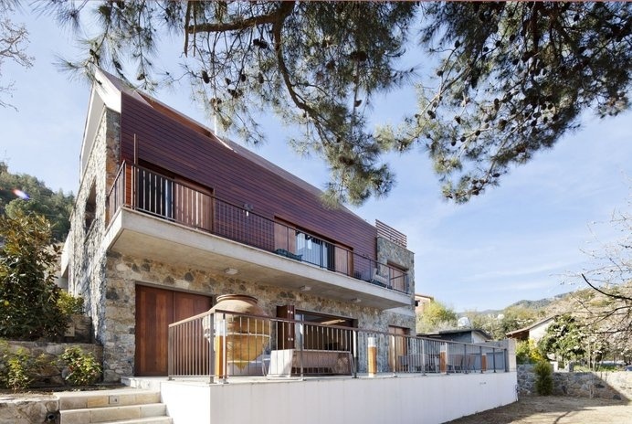 Stone and Irokko Wood Shaping a Home in Picturesque Cyprus Village #architecture