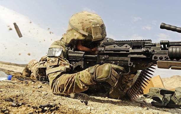 U.S. Air Force soldier fires the Mk48 super SAW machine gun.
