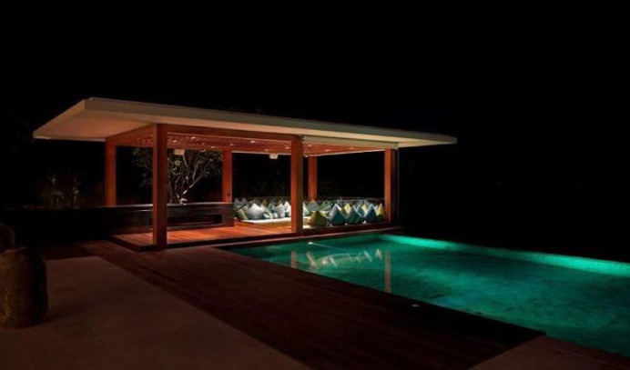 An expansive luxury villa in Choeng Mon offering 5 double bedrooms and 7 bathrooms, with 3 lounge areas, gym, private cinema, games room, garden, L-shaped infinity edge pool and modern amenities. Book Now with Villa Getaways!