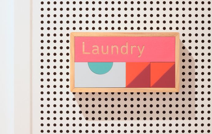 Stacked building blocks form signage for Sydney children's daycare