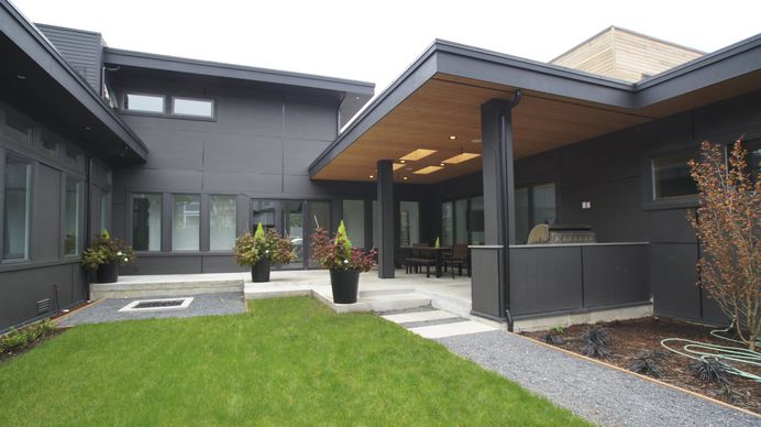 The back of the house has an all grey exterior that lets the modern design speak for itself. Photo 1 of 1707 in Search "patio" from Modern Courtyard Home