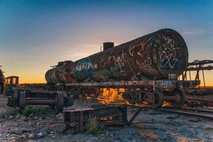 Chris Staring Captured Stunnung Cemetery of Abandoned Trains in Bolivia